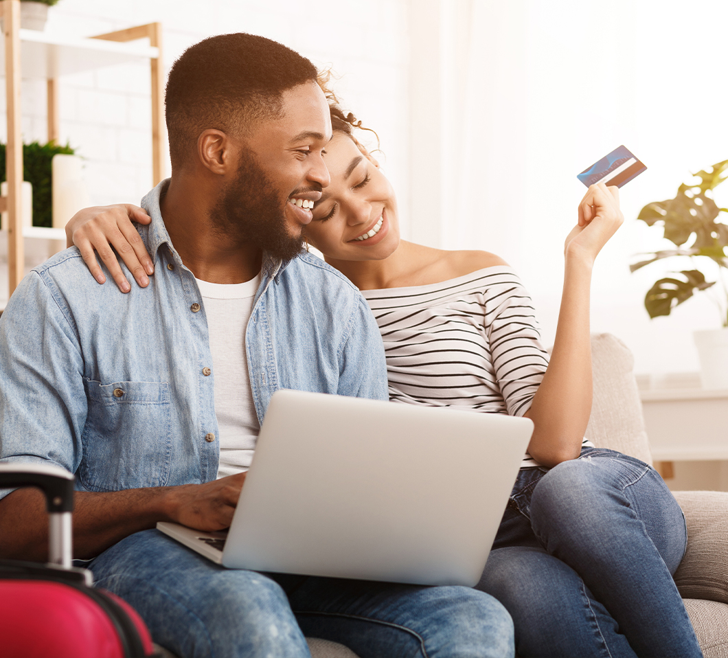 couple smiling with laptop