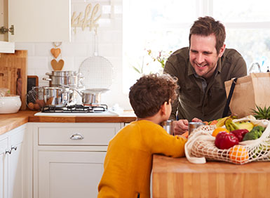 family smiling around table