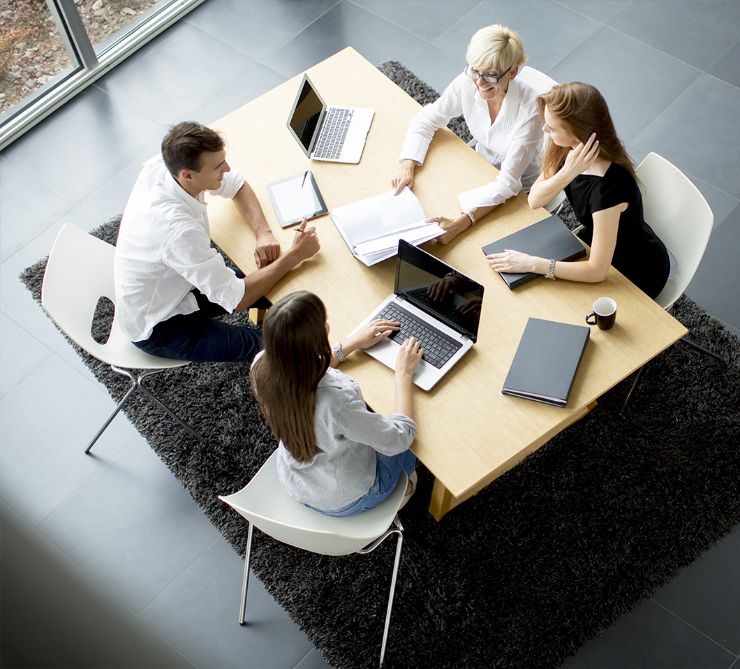 overhead view of people around conference table