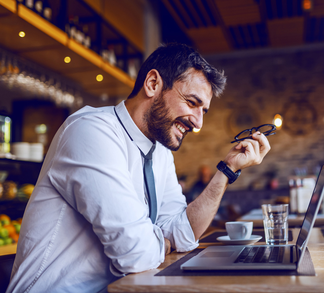 man on video chat at restaurant