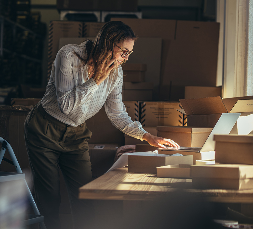 young woman processing orders for small business