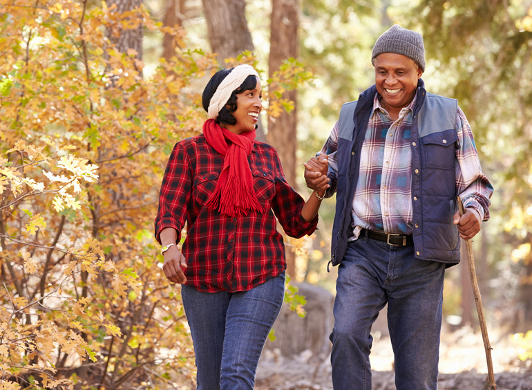 couple taking a hike in the fall