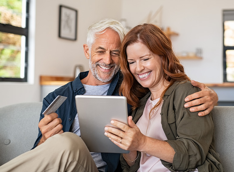 couple smiling on tablet