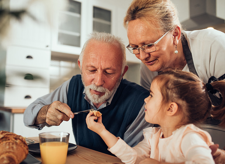 grandparents having fun with little girl