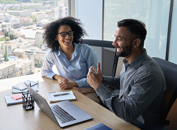 2 people sitting at desk